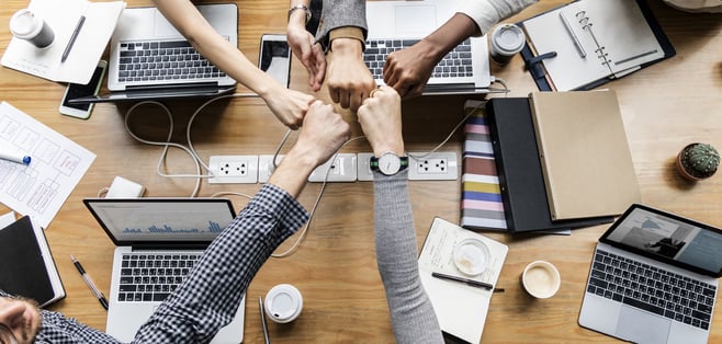 colleagues giving fist bump 1
